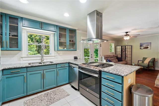 1192 Eastridge Rd SW, Atlanta, GA 30311 - kitchen with sink, appliances with stainless steel finishes, light stone counters, island exhaust hood, and kitchen peninsula