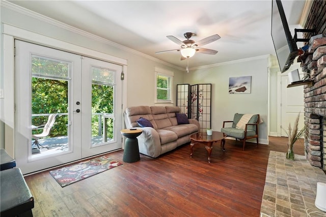 1192 Eastridge Rd SW, Atlanta, GA 30311 - living room featuring a brick fireplace, dark wood-type flooring, ornamental molding, and french doors