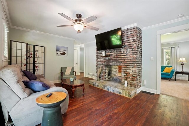 1192 Eastridge Rd SW, Atlanta, GA 30311 - living room featuring a fireplace, crown molding, wood-type flooring, and ceiling fan