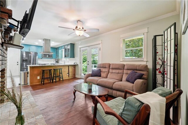 1192 Eastridge Rd SW, Atlanta, GA 30311 - living room featuring french doors, dark wood-type flooring, sink, crown molding, and ceiling fan