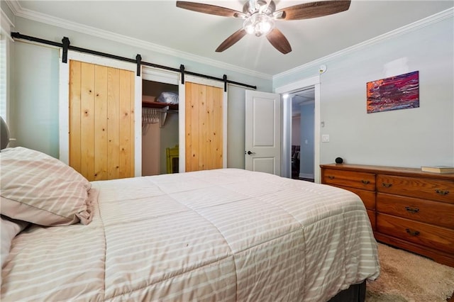 1192 Eastridge Rd SW, Atlanta, GA 30311 - bedroom with crown molding, carpet floors, a barn door, and ceiling fan