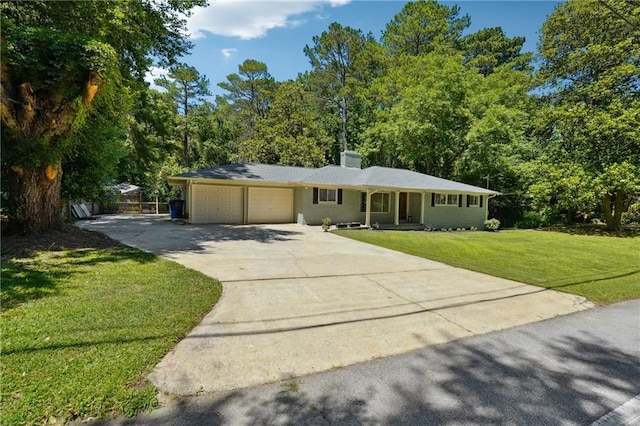 ranch-style house featuring a garage and a front yard