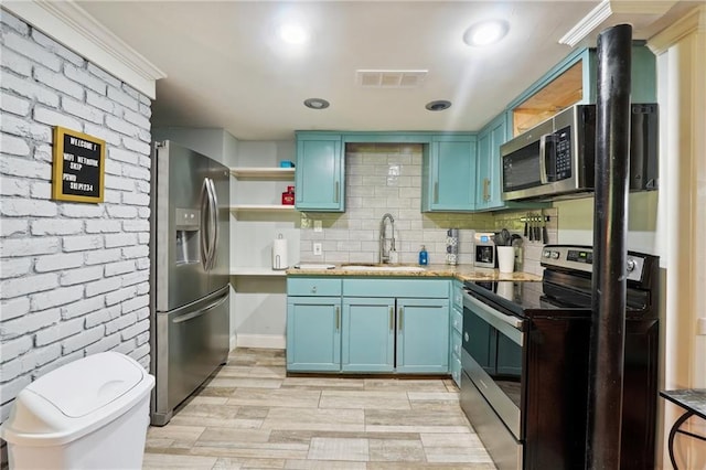 1192 Eastridge Rd SW, Atlanta, GA 30311 - kitchen with light hardwood / wood-style floors, appliances with stainless steel finishes, blue cabinets, and sink