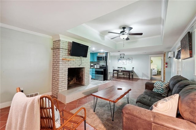 1192 Eastridge Rd SW, Atlanta, GA 30311 - living room featuring crown molding, a brick fireplace, light tile patterned floors, a tray ceiling, and ceiling fan