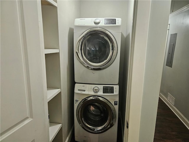 1192 Eastridge Rd SW, Atlanta, GA 30311 - washroom with stacked washer and dryer and dark hardwood / wood-style floors