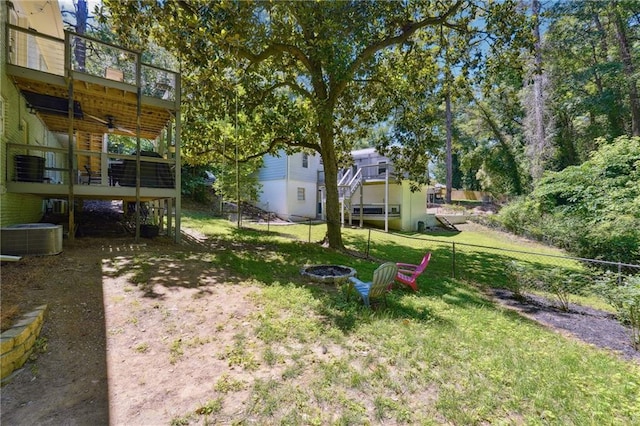 1192 Eastridge Rd SW, Atlanta, GA 30311 - view of yard featuring an outdoor fire pit, ceiling fan, and central air condition unit