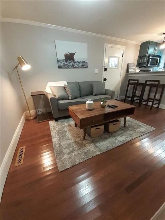 1192 Eastridge Rd SW, Atlanta, GA 30311 - living room featuring crown molding and dark hardwood / wood-style floors