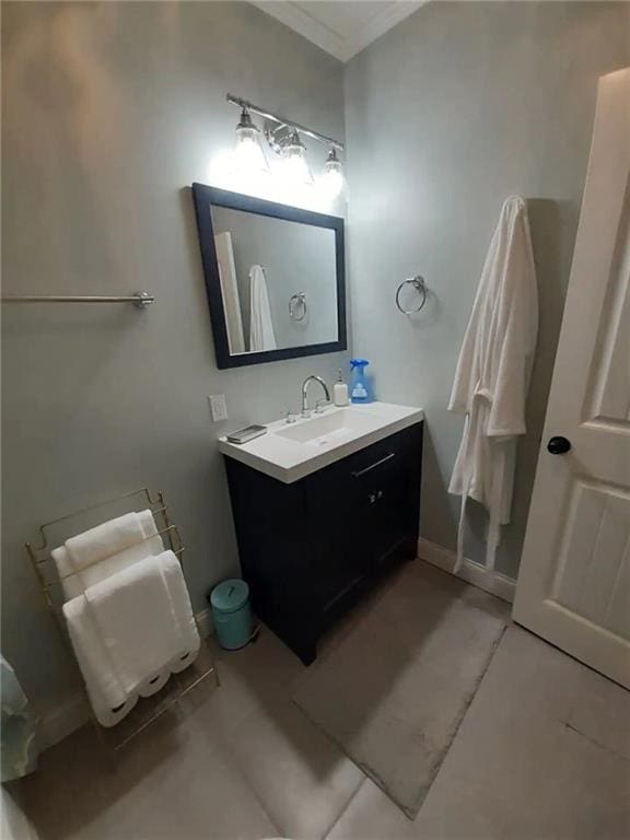 1192 Eastridge Rd SW, Atlanta, GA 30311 - bathroom with ornamental molding, vanity, and tile patterned flooring