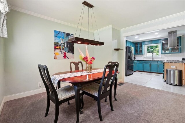 1192 Eastridge Rd SW, Atlanta, GA 30311 - carpeted dining room with ornamental molding and sink