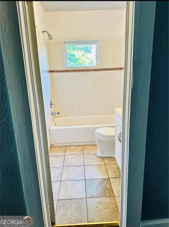 430 E 23rd St, Anniston, AL 36207 - bathroom featuring toilet, shower / bathtub combination, tile patterned floors, and vanity