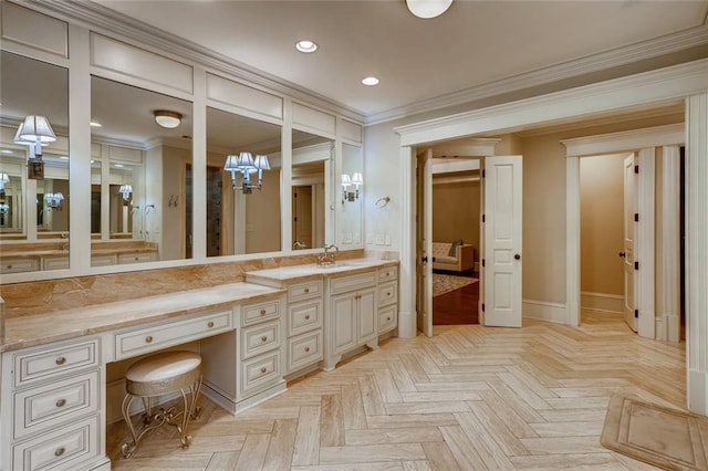 bathroom featuring crown molding, vanity, and parquet floors