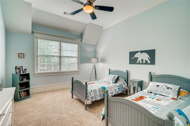 carpeted bedroom with crown molding and ceiling fan