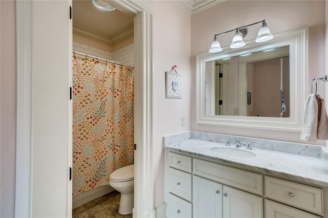 bathroom featuring tile flooring, crown molding, vanity with extensive cabinet space, and toilet