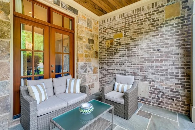 view of terrace featuring an outdoor living space and french doors