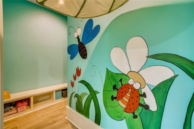 playroom featuring light wood-type flooring