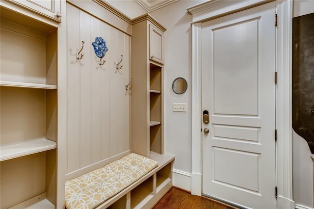 mudroom with ornamental molding and dark hardwood / wood-style floors