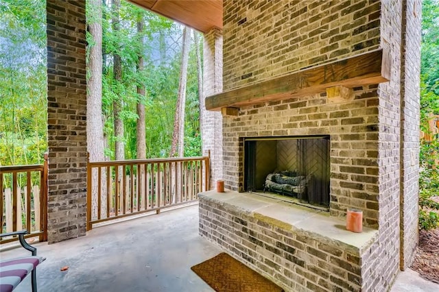 view of patio / terrace with an outdoor brick fireplace