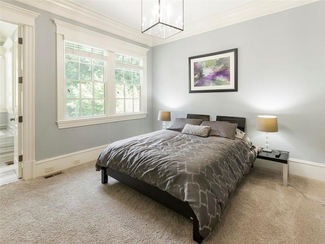 carpeted bedroom featuring ornamental molding