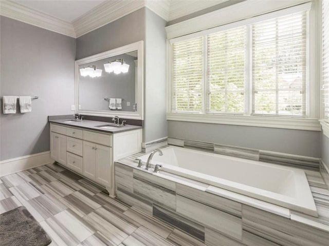 bathroom featuring a relaxing tiled bath, plenty of natural light, dual bowl vanity, and ornamental molding