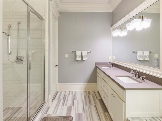 bathroom featuring dual vanity, an enclosed shower, and crown molding