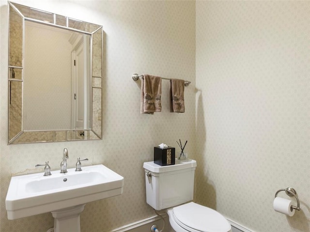 bathroom with toilet and sink