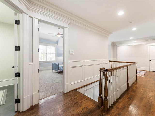 hallway featuring crown molding and dark hardwood / wood-style floors