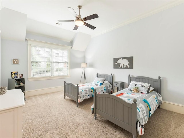 bedroom featuring ceiling fan, crown molding, and light carpet