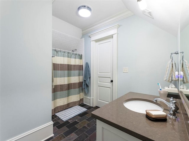 bathroom featuring tile flooring, ornamental molding, and vanity