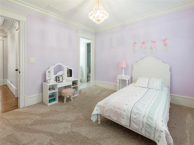 carpeted bedroom featuring ornamental molding and a notable chandelier