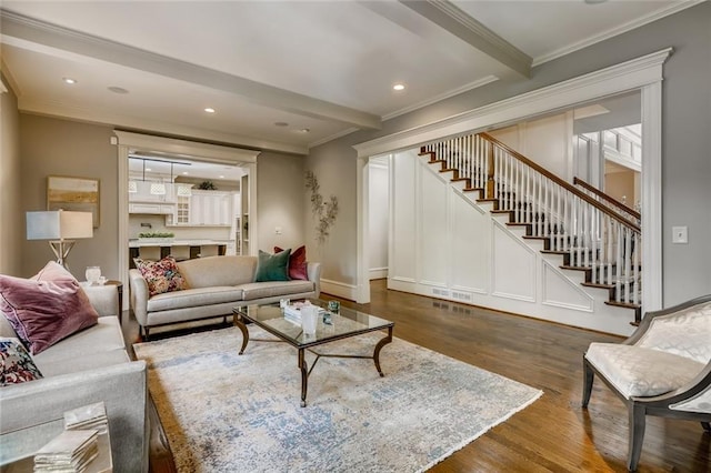 living room with crown molding, dark hardwood / wood-style flooring, and beamed ceiling