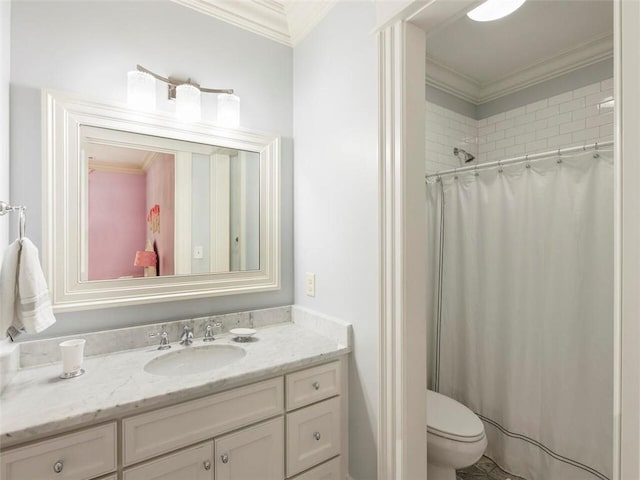 bathroom featuring toilet, ornamental molding, and vanity