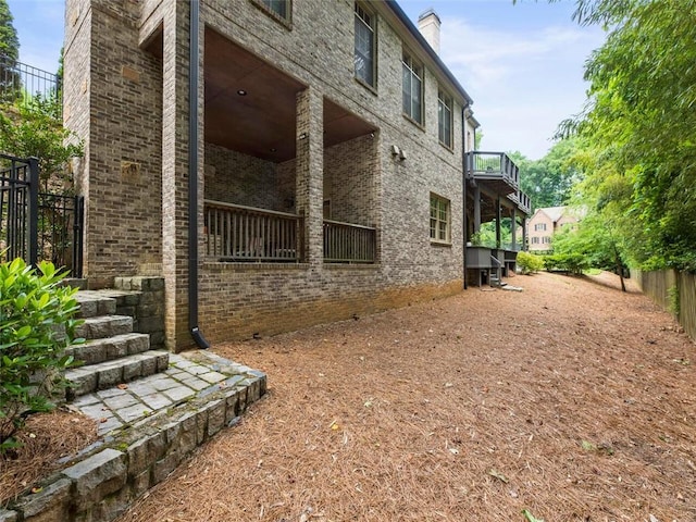 view of home's exterior featuring a balcony