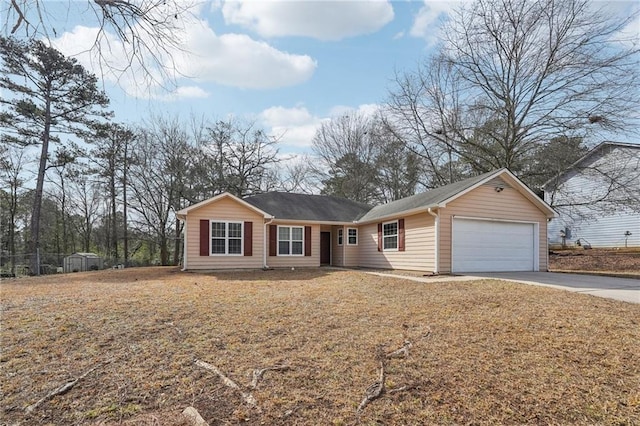 single story home with an attached garage, driveway, and a front yard