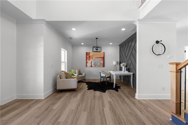 sitting room with visible vents, recessed lighting, stairway, light wood-style floors, and baseboards