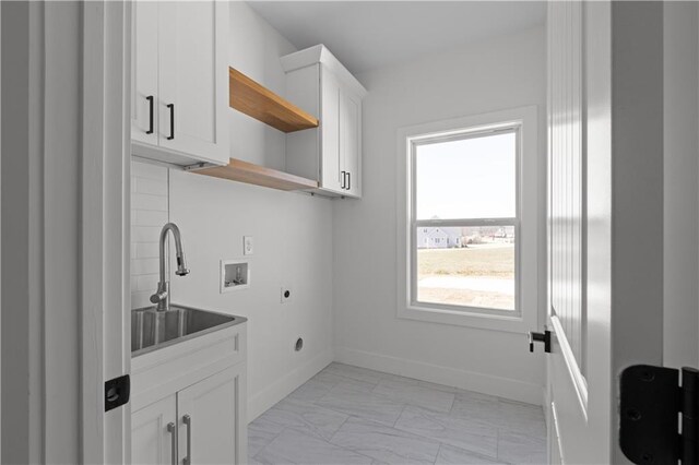 laundry area featuring washer hookup, cabinet space, electric dryer hookup, marble finish floor, and a sink