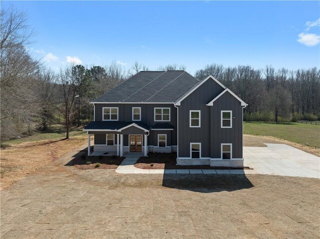 view of front of home featuring covered porch and board and batten siding