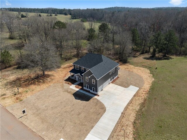 drone / aerial view with a view of trees