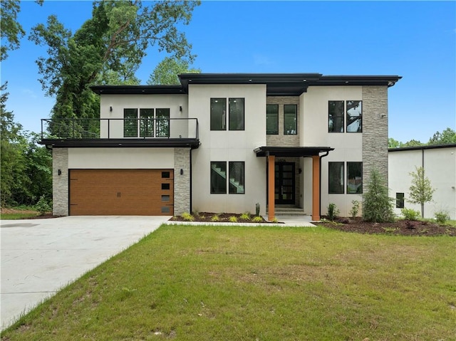 1604 Niskey Lake Rd, Atlanta, GA 30331 - contemporary home featuring a balcony, concrete driveway, stucco siding, and a front lawn