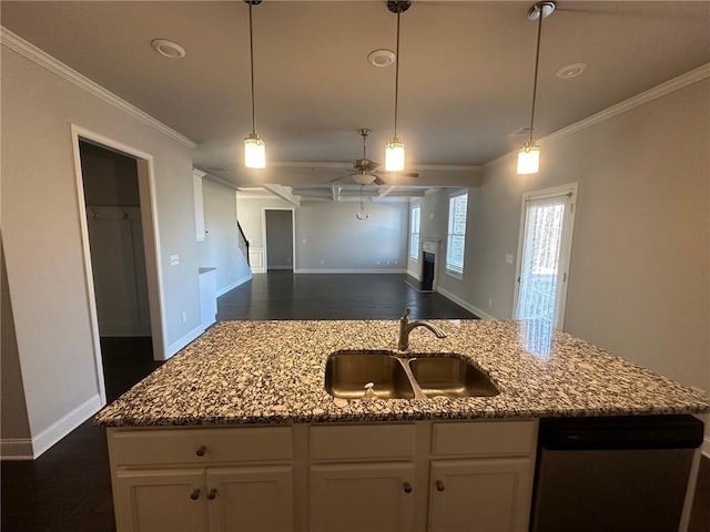 kitchen featuring white cabinetry, sink, stainless steel dishwasher, and a kitchen island with sink