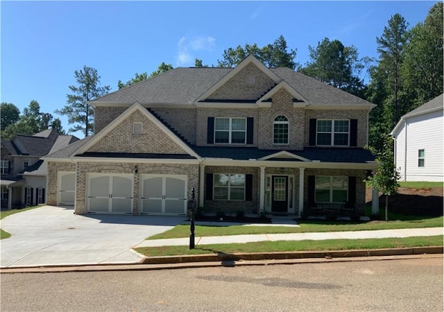 craftsman inspired home with a front lawn