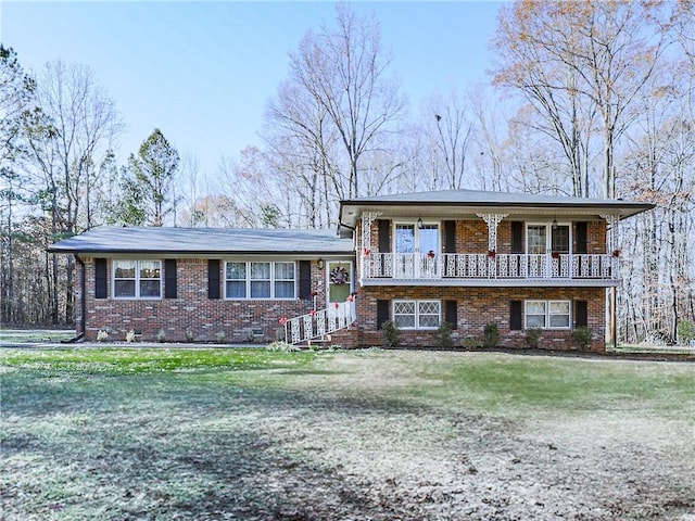 tri-level home with a front yard