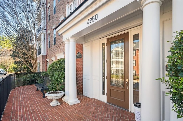 entrance to property featuring covered porch