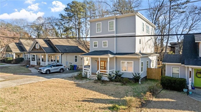 view of front of house featuring covered porch and driveway