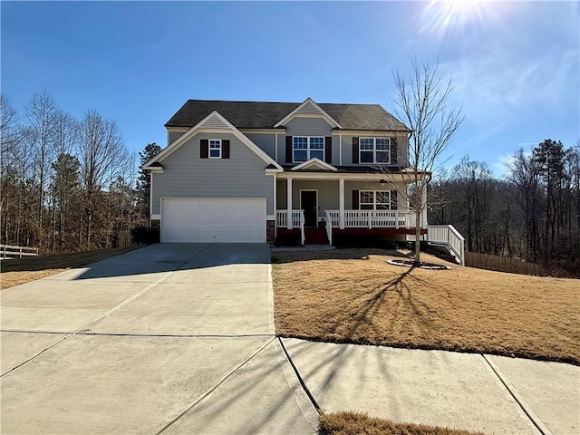 view of front of property featuring a porch and a garage