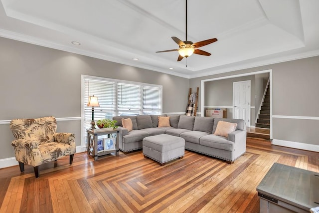 955 Chandler Haulk Rd, Loganville, GA 30052 - living room with a tray ceiling, a ceiling fan, recessed lighting, baseboards, and ornamental molding