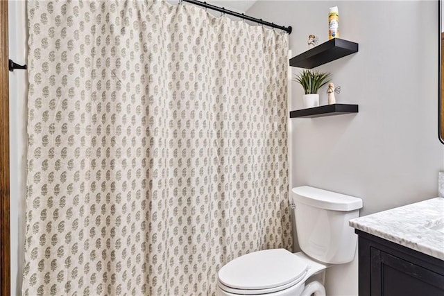 full bath featuring vanity, curtained shower, and toilet