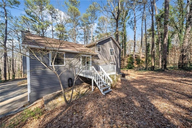 view of property exterior featuring a chimney