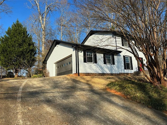 view of home's exterior featuring a garage