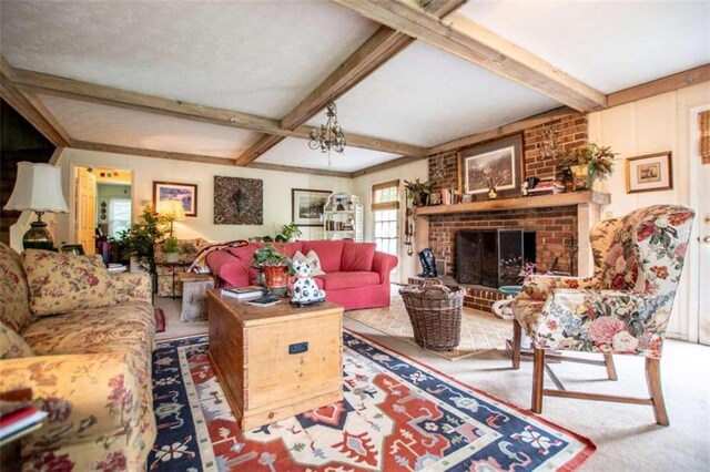 carpeted living room with brick wall, beamed ceiling, and a brick fireplace