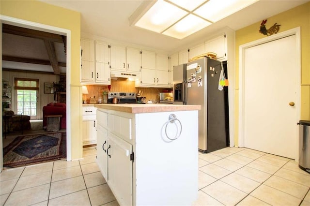 kitchen with decorative backsplash, beam ceiling, range, light tile patterned floors, and stainless steel fridge with ice dispenser